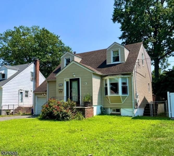 Spacious Expanded 3 Bedroom, 3 Bath Cape with open Living Room to Kitchen space that leads to rear yard Deck.