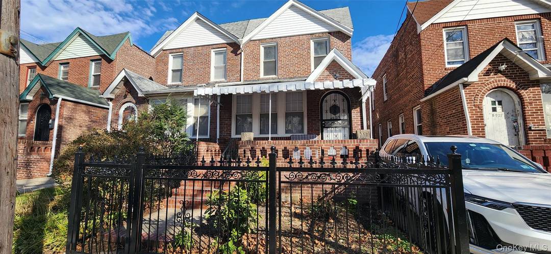 Totally Renovated BRICK Semi Detached Big Backyard, with Rebuilt Garage Beautiful front Porch 5 minutes to Grand Central Pkwy and Long Island Expressway 1 block from Hillside Ave.