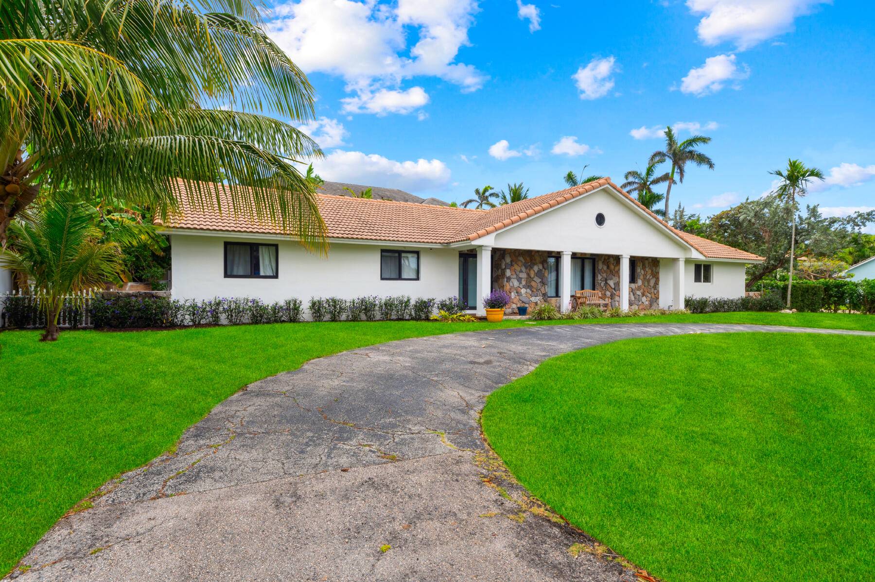 Discover the timeless allure of Florida living with this charming residence, perfectly nestled between the Intracoastal Waterway and the tranquil beach.