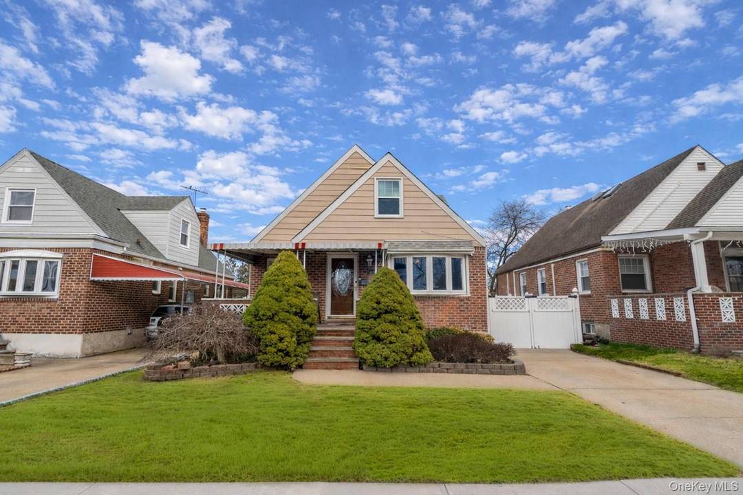 Welcome home to this beautifully maintained brick cape offering space, comfort and timeless charm in the heart of Fresh Meadows.