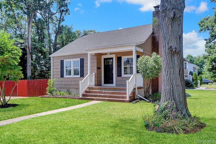 Fantastically updated Cape Cod style with redone floors, freshly painted, gorgeous kitchen and beautifully updated bathrooms, having exceptional charm combined with improvements for modern living.