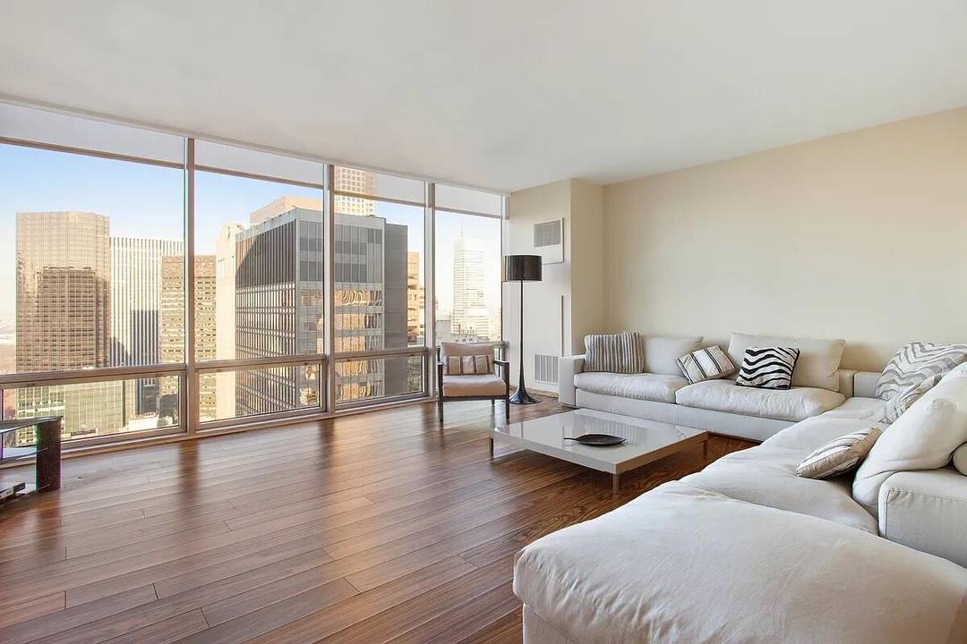 Spectacular Central Park and cityscape views define this meticulously renovated 2 bedroom, 2 bathroom residence on the 38th floor of Fifth Avenue's iconic Olympic Tower.