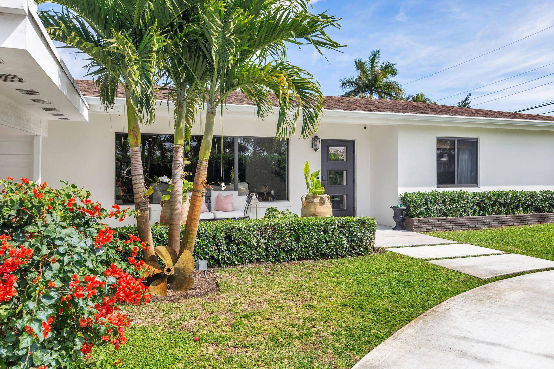 Situated in the heart of Lake Clarke Shores on Pine Tree Lane, south of Forest Hill Blvd.