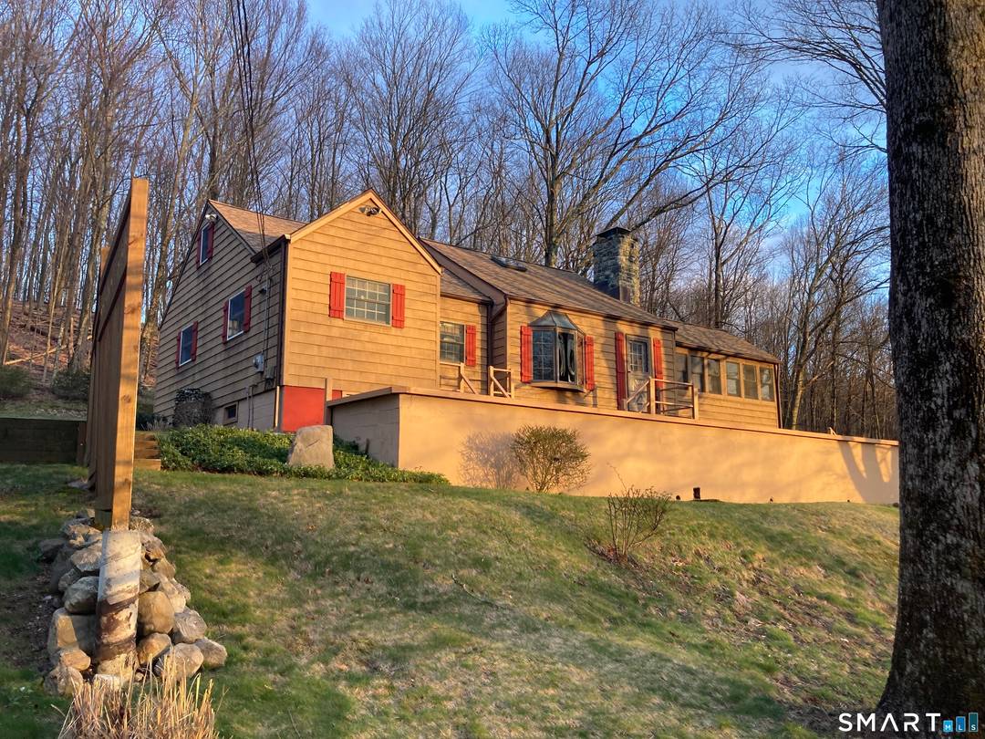 Privately positioned on over 5 secluded acres on Danbury's coveted west side, this elevated residence commands the landscape w quiet confidence.