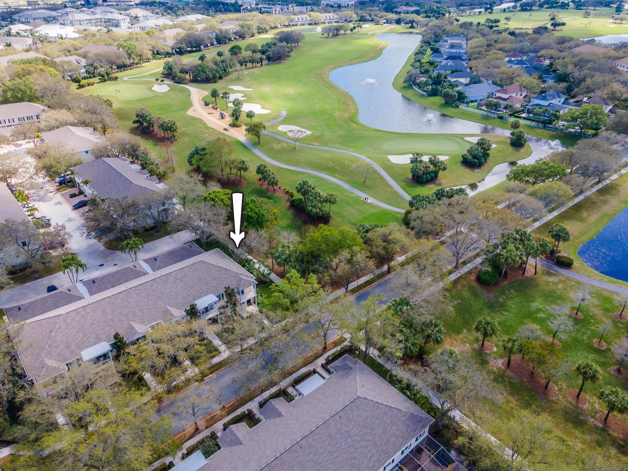 RARE END UNIT townhome in Charleston Court offering additional windows and unobstructed golf course and lake views, located on the 8th tee.