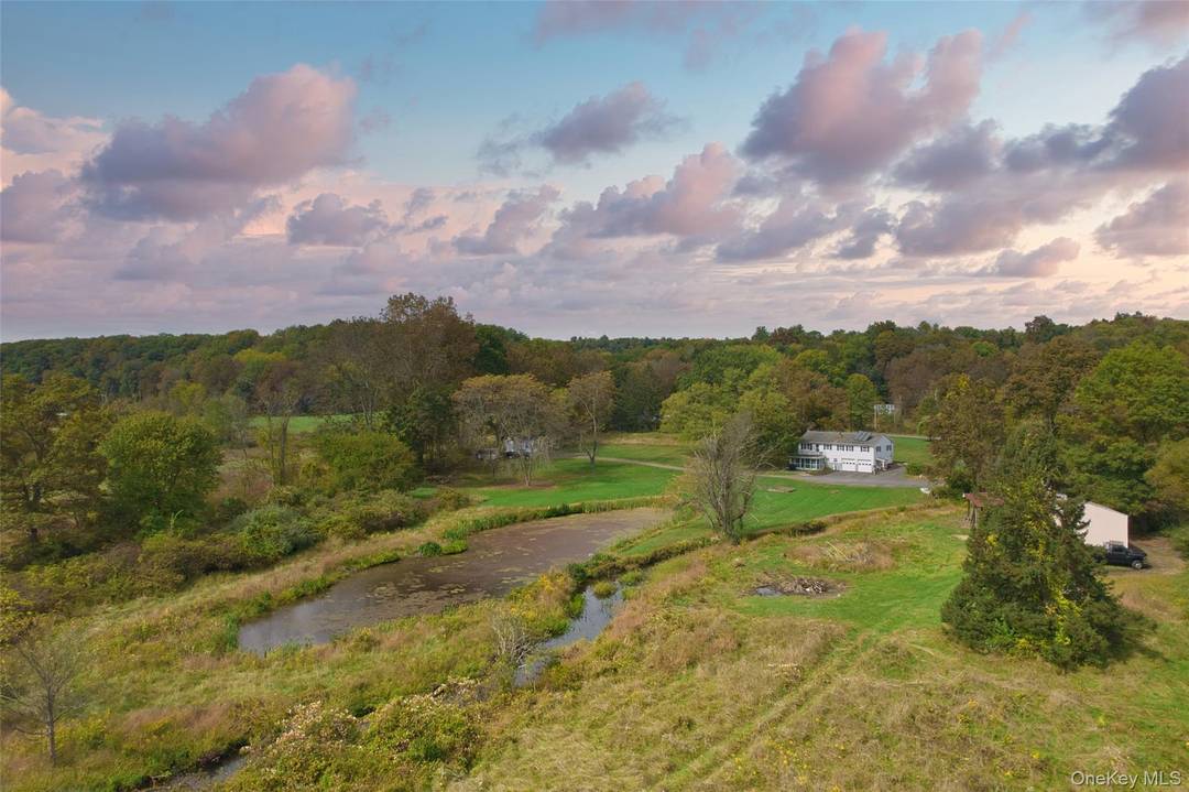 Exceptional 11 acre estate on one of Stone Ridge's most sought after country roads.