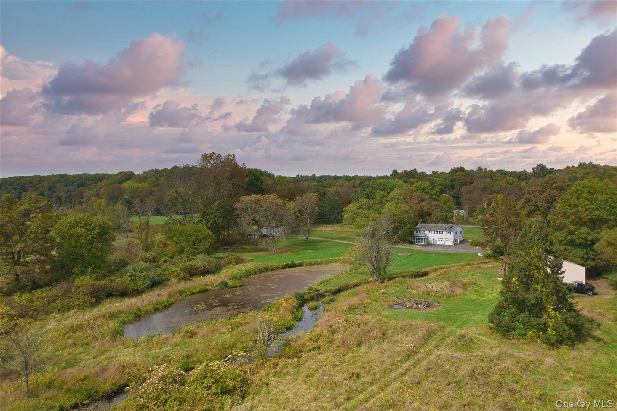Exceptional 11 acre estate on one of Stone Ridge's most sought after country roads.