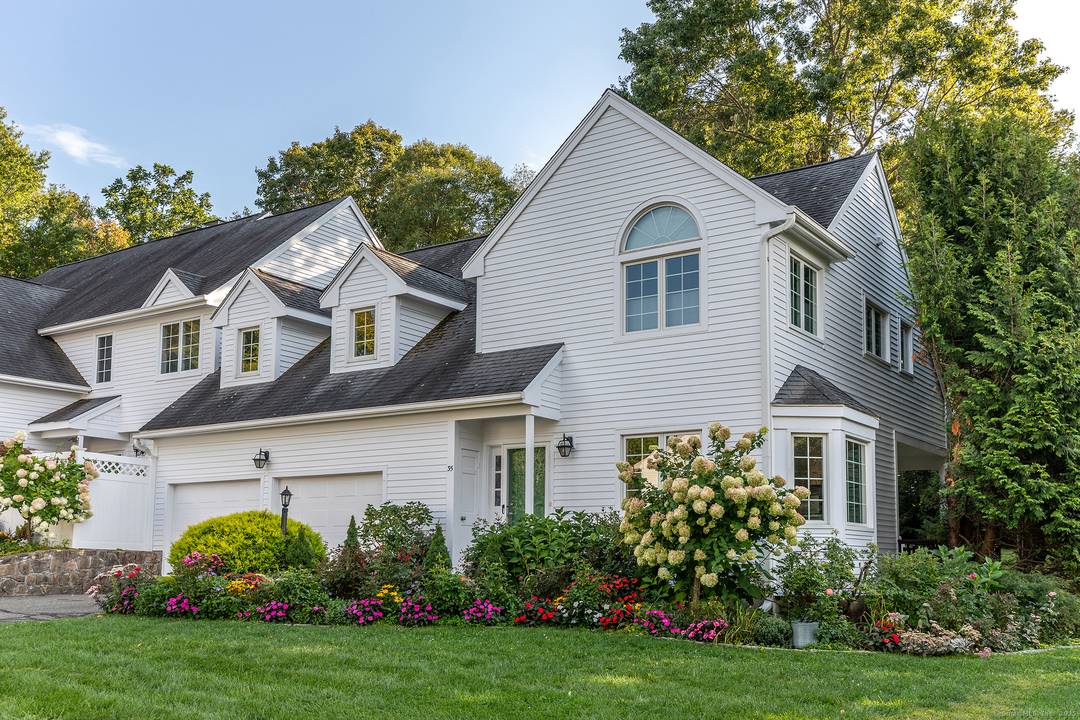 Rare offering at Quarry Ridge in Washington this beautifully updated, light filled townhouse combines privacy, modern comfort and cottage gardens in a coveted location.