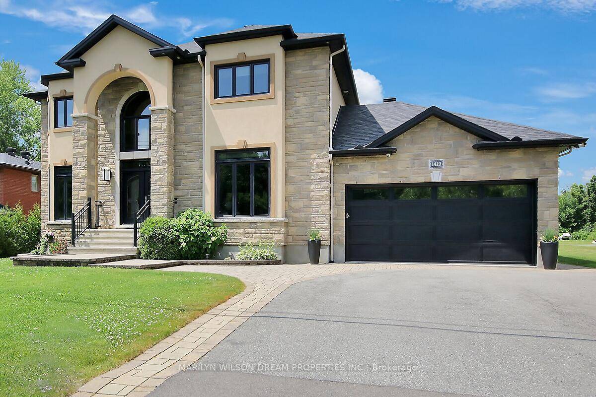 This elegant custom built estate home is marked by impeccable design and the finest quality of materials and finishes.