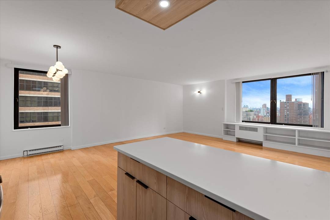 The largest two bedroom, two bath apartment on the highest floor of the Ruppert Yorkville complex, this tranquil corner home offers the most desirable convertible three layout.