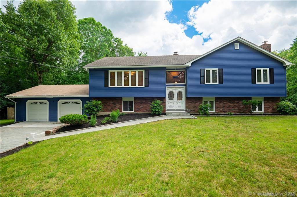 Tucked away in a peaceful and secluded part of Hamden, this expansive raised ranch offers the perfect blend of space, comfort, and natural beauty.