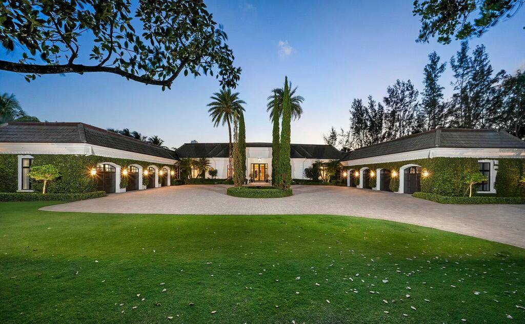 Nestled along 200 feet of pristine Intracoastal waterfront, this unparalleled estate offers the ultimate in luxury living, complete with direct access to the water, a private dock with a lift, ...