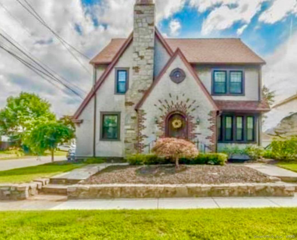 Charming Tudor style home on a desirable corner lot !