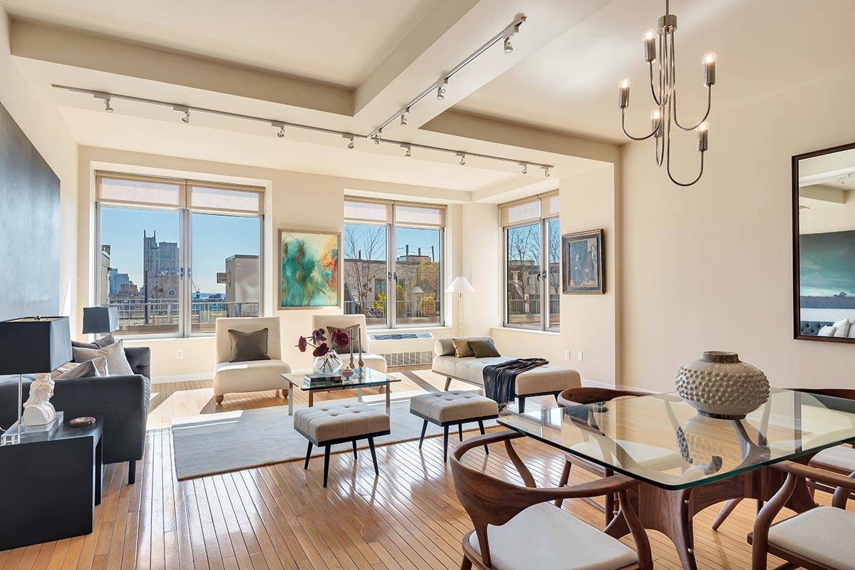 This split 2 bedroom 2 bathroom loft is positioned on a high floor and captures brilliant light filtered through 10 oversized windows.