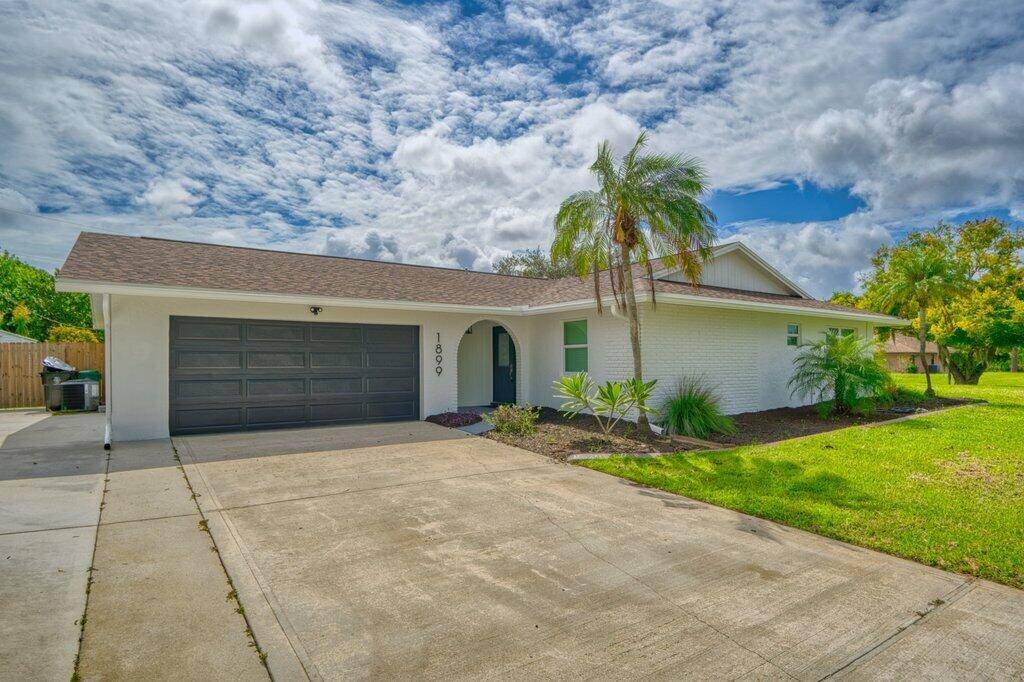 Stunning renovated 3BR 2BA pool home on a large corner lot with fenced yard.