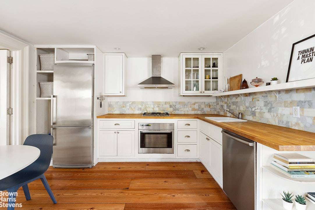 This floor through 2 bedroom apartment is both charming and spacious.