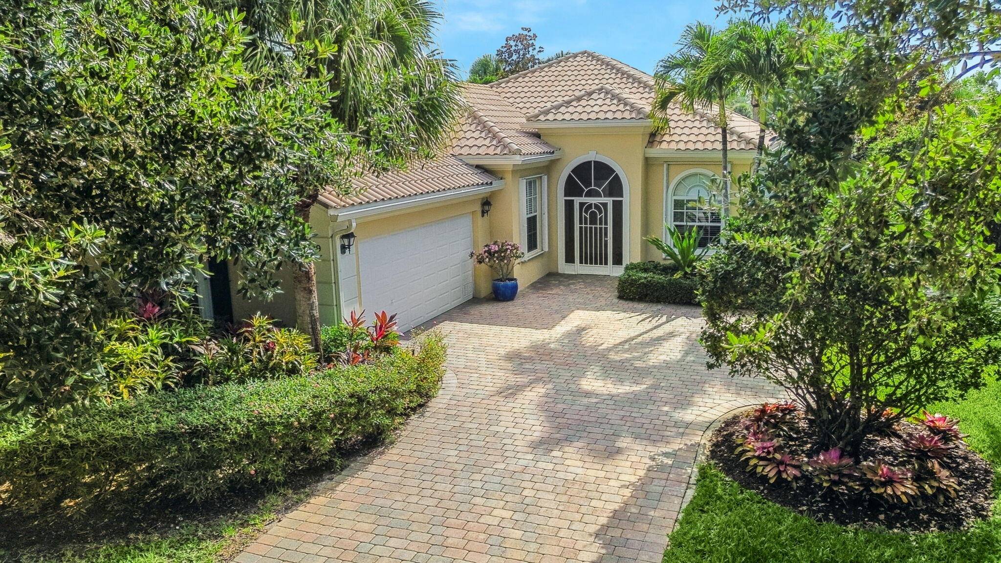 Welcome to this beautifully updated DiVosta built home in the highly sought after gated community of Magnolia Bay in Palm Beach Gardens !