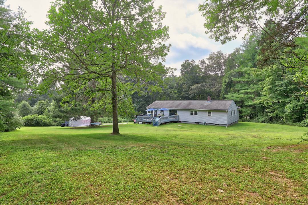 Welcome to 2 Old Turnpike Road, a classic 3 bedroom, 2 bath ranch nestled on 2.