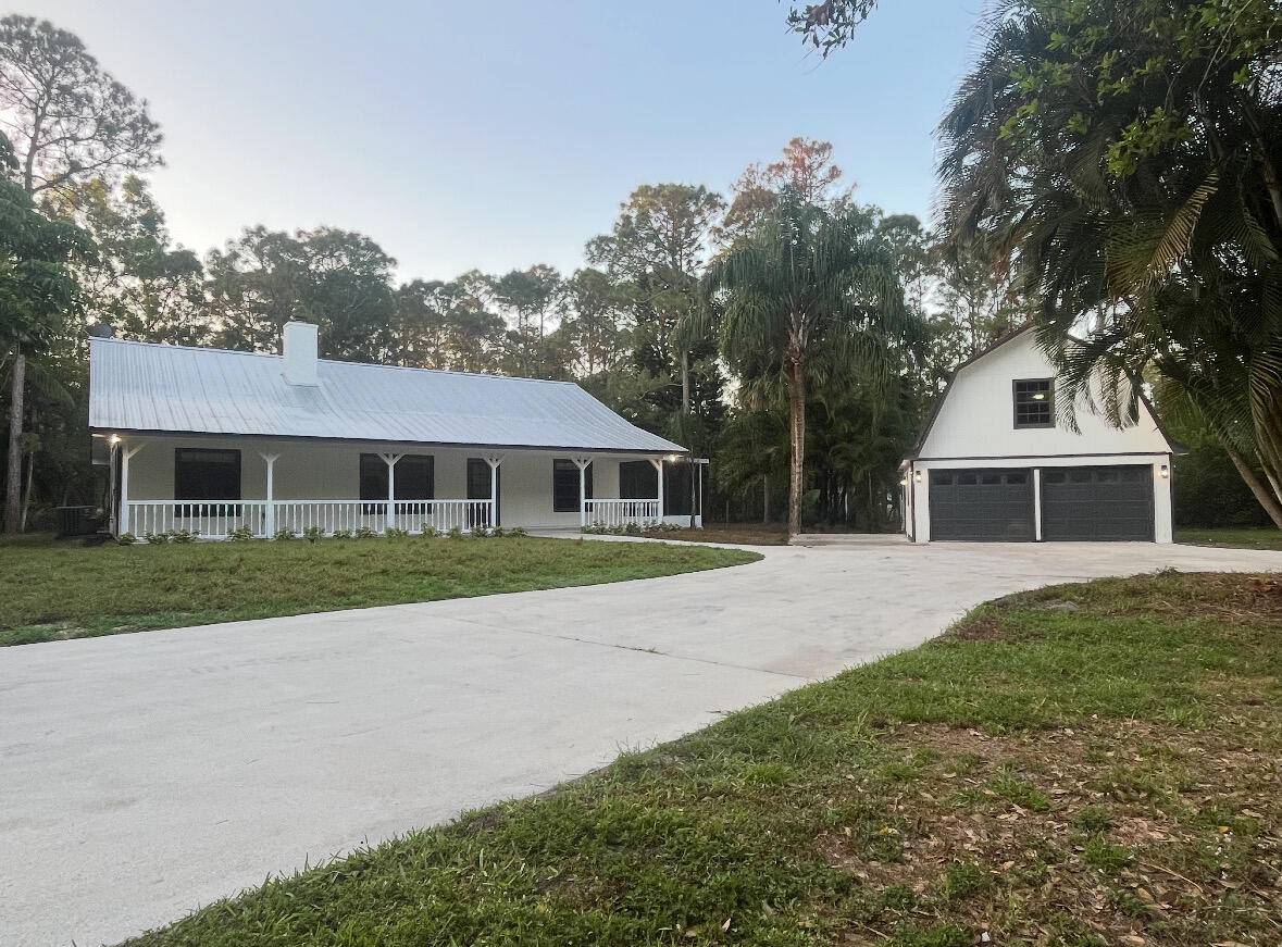 Escape to your Private Oasis in the Heart of Jupiter Farms Nestled on 1.