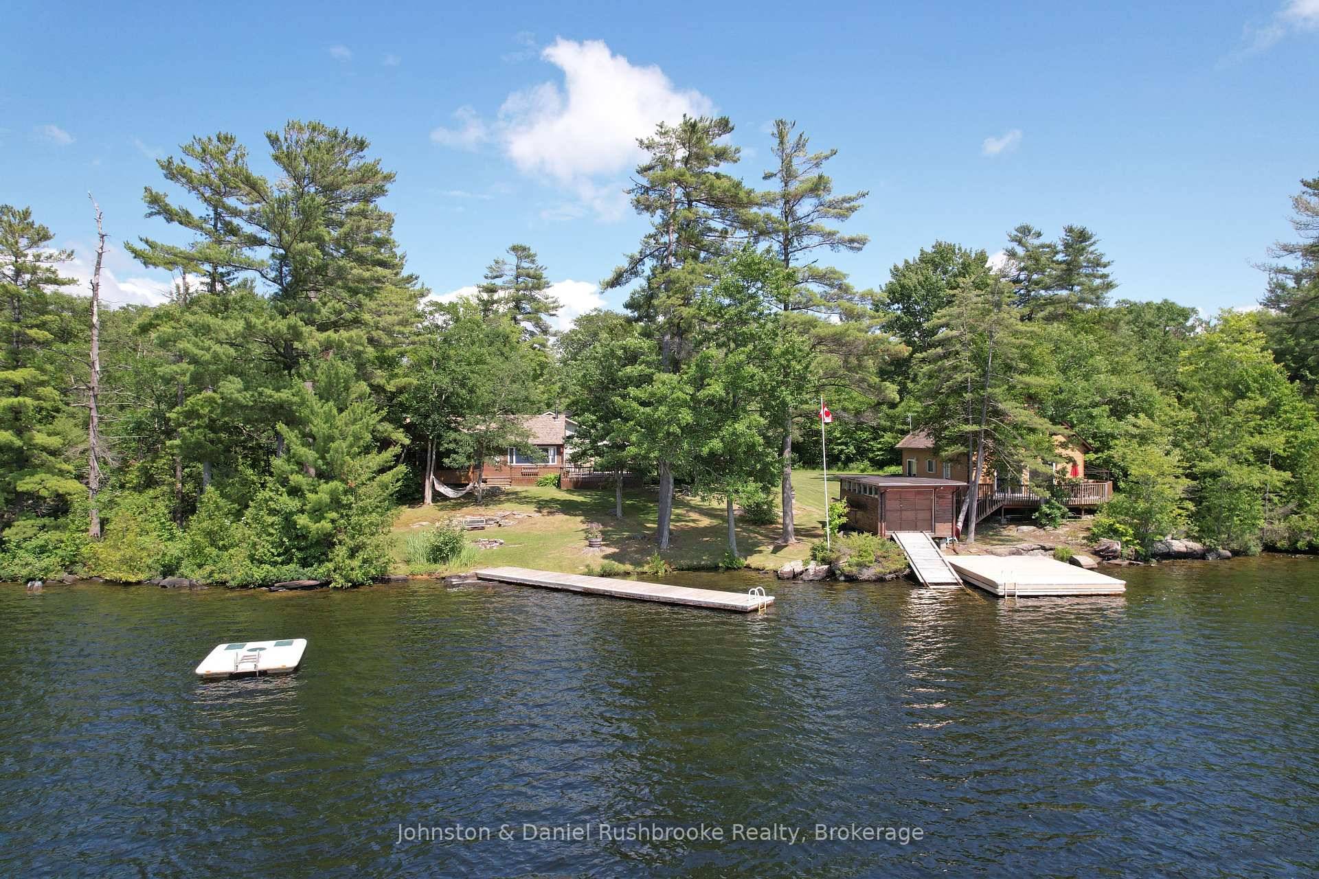 This beautiful private family retreat on Six Mile Lake boasts 235 feet of prime west facing shoreline, capturing spectacular sunsets and all day sun.