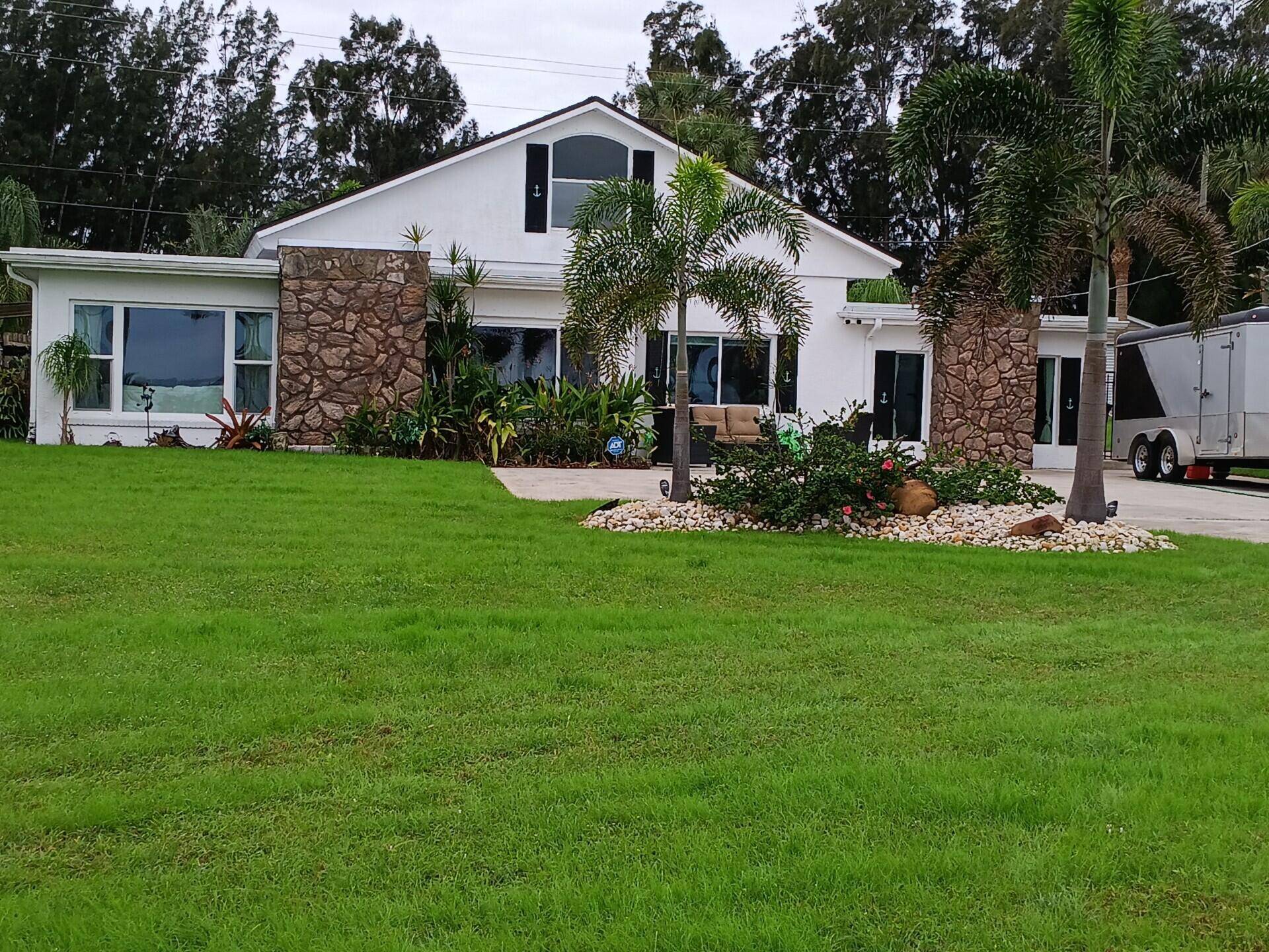 Updated, beautifully landscaped, on the Intercoastal, approximately 100' of waterfrontage.