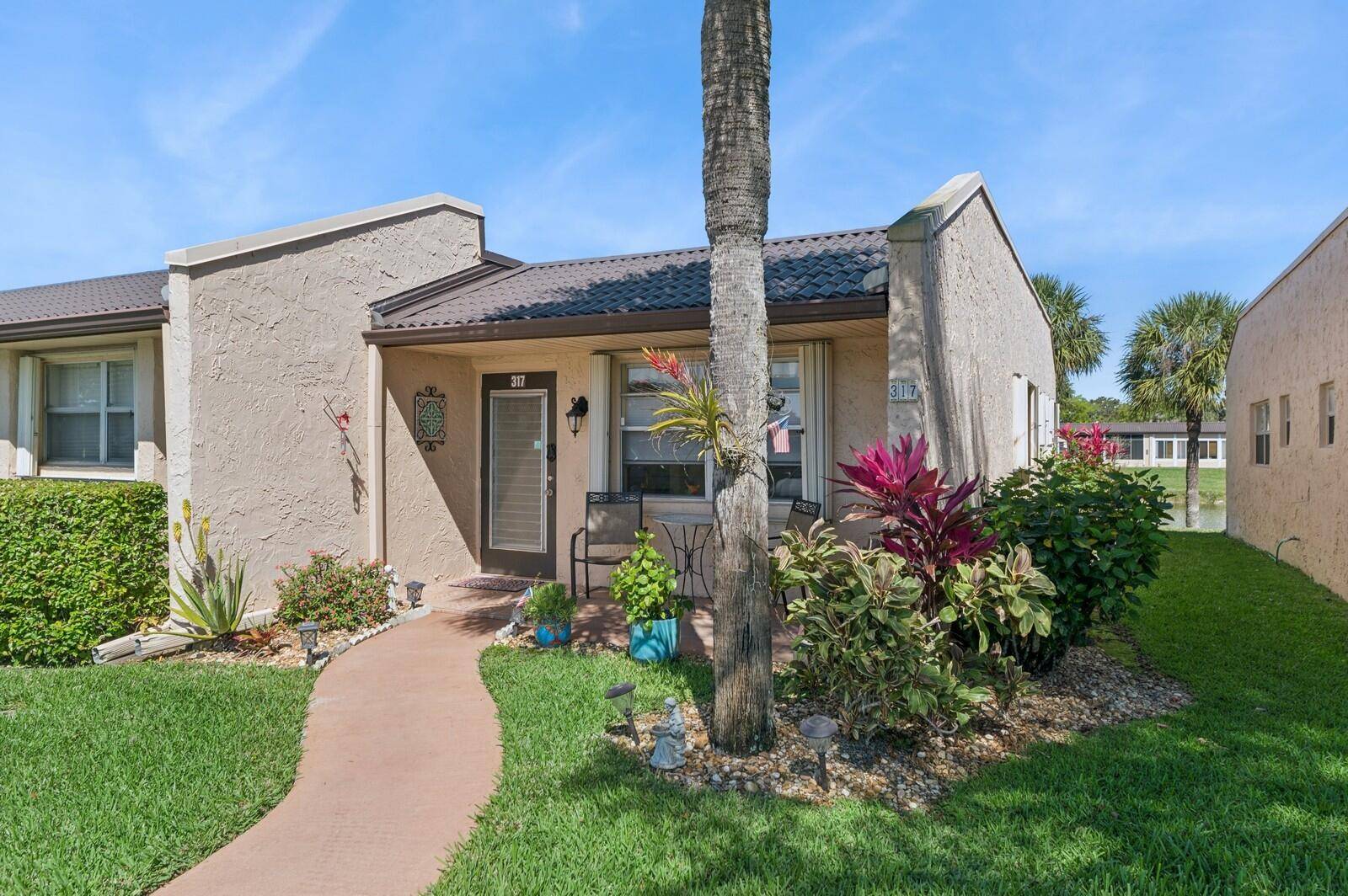 Charming 2 2 WATERFRONT End unit in the 55 community of Golden Lakes, with a 24 7 Manned Guard Gate !