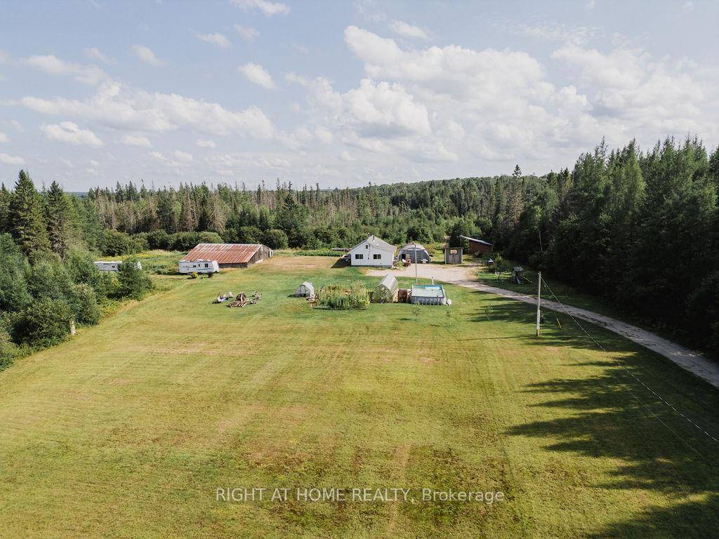 Set on 92 scenic acres, this charming country retreat offers room to live, work, and play.