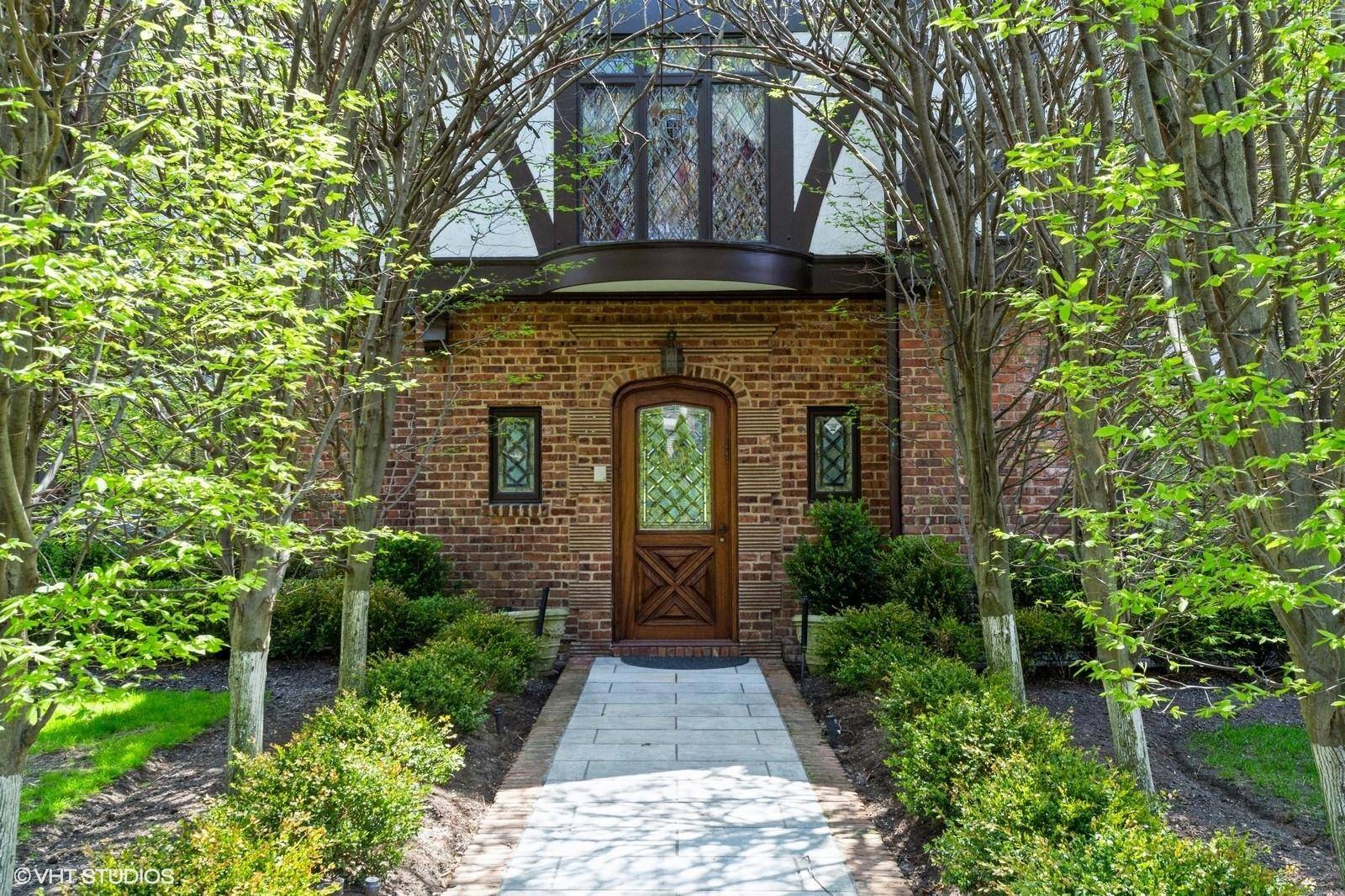 Palatial and exquisitely appointed, this stunning tudor colonial showcases, architectural moldings, a grand entryway, soaring ceilings, and a sweeping staircase, This home features an elegant formal living room, a banquet ...