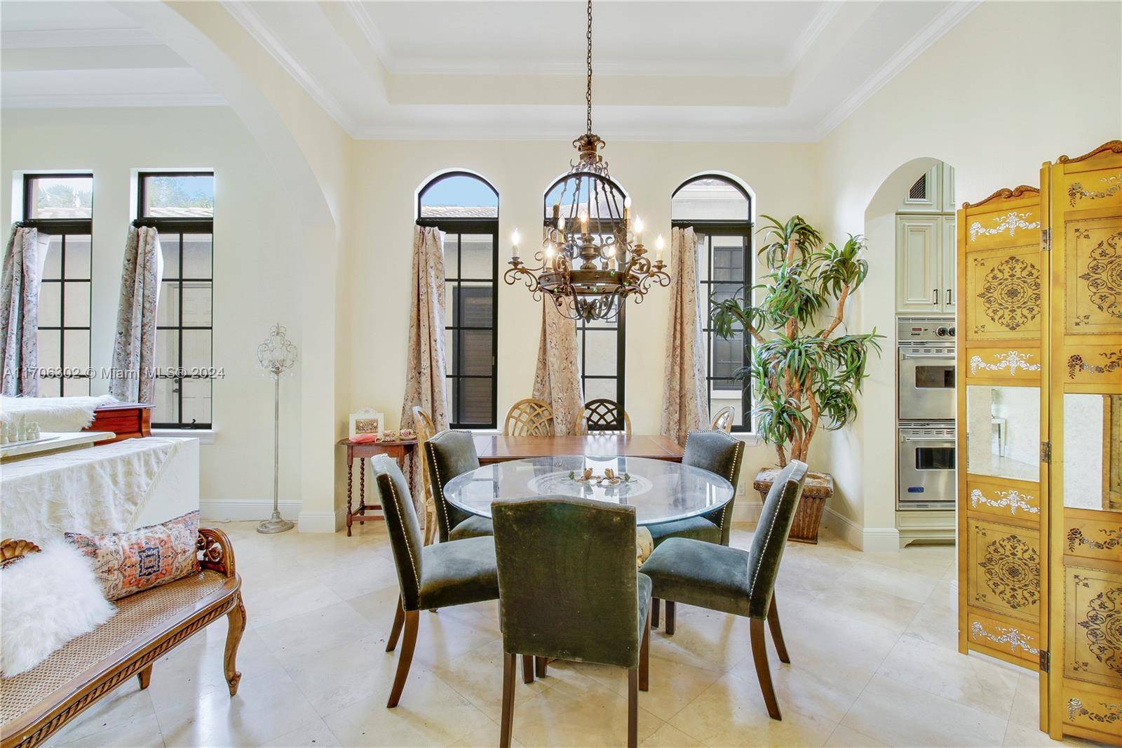 Stunning custom home with a beautiful fountain view and resort style amenities in South Florida's best golfing community !