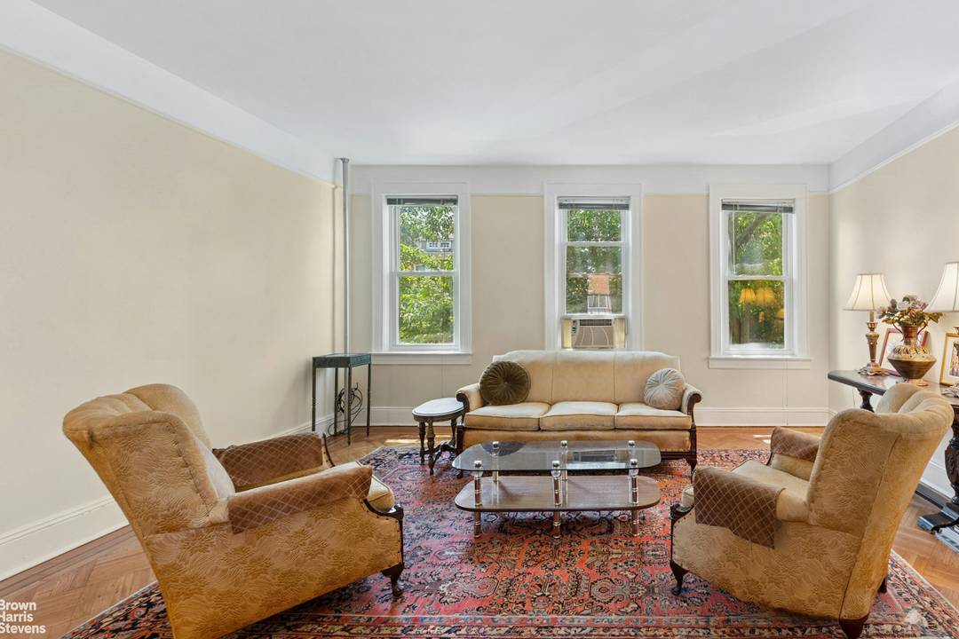 Welcome to the charming enclave of Forest Hills, where sophisticated city living meets quaint neighborhood charm.