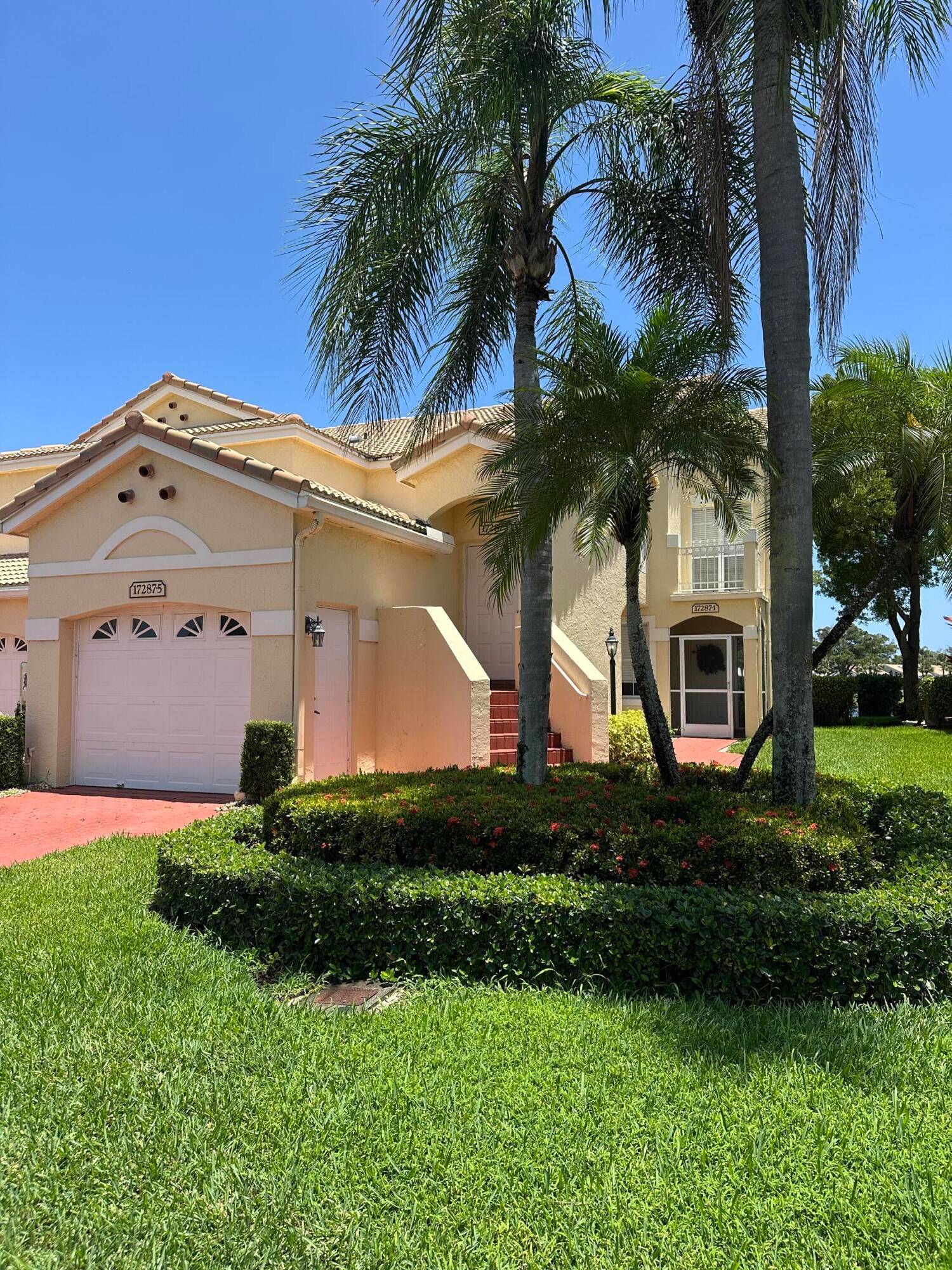 Stunning 3 2 corner unit coach home in the highly desired Boca Country Club.