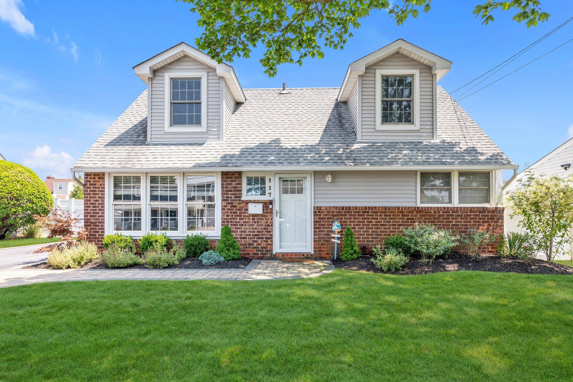 Welcome to 117 Belmill Road, a captivating residence nestled in the heart of South Bellmore.