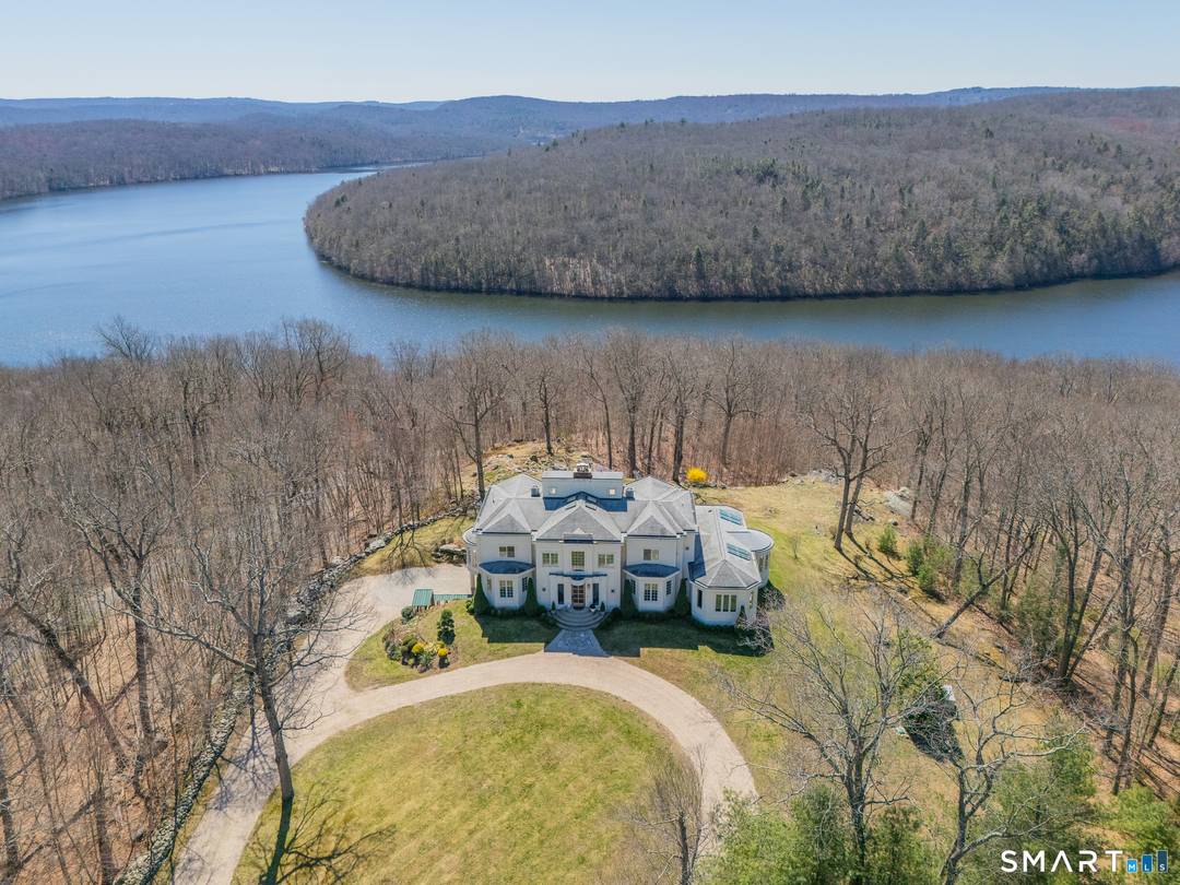 Spectacular modern hilltop retreat set within a private lake community of just a handful of homes.