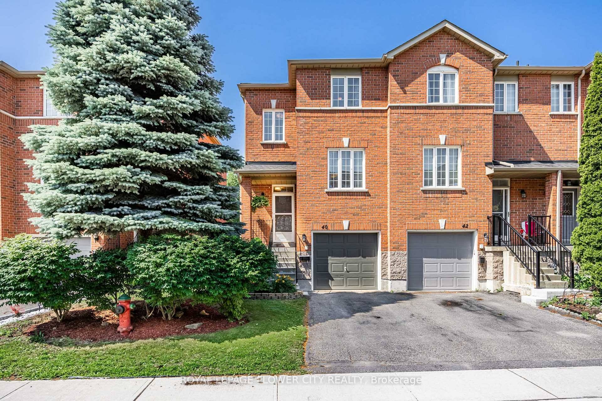 Enjoy this End Unit Townhouse That Feels Like A Semi with Exterior Access To The Backyard From Outside !
