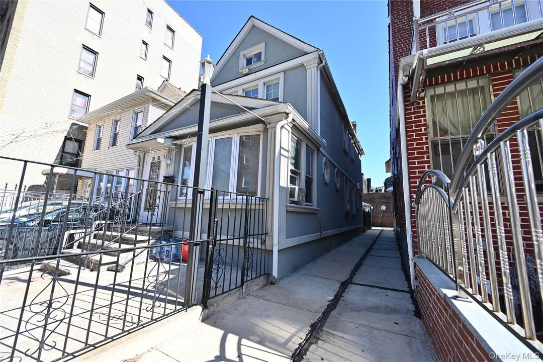 Detached home in the heart of Elmhurst, featuring 3 spacious bedrooms, 1.