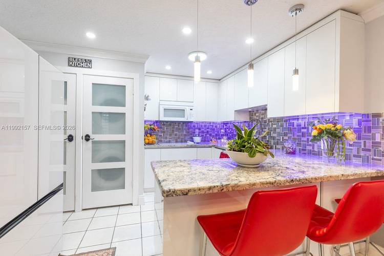 Charming, fully remodeled 4 bedroom, 2 bathroom corner home that truly feels like a picture perfect dollhouse.