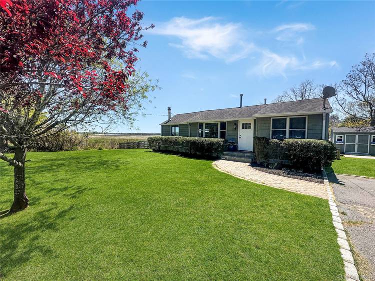Welcome to 57 Nash Street in Flanders, a light filled waterfront retreat that captures the essence of easy Hamptons living.