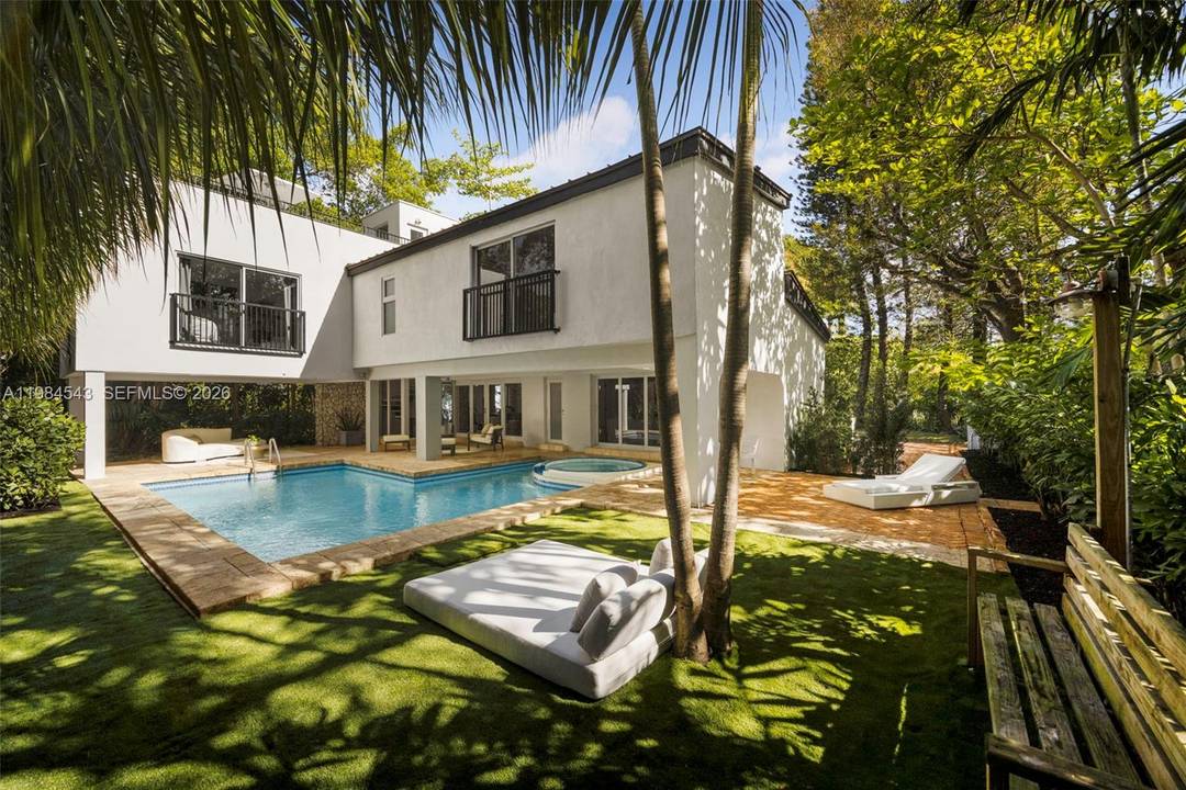 Thoughtfully remodeled mid century residence on a prominent corner lot in South Coconut Grove, not in a flood zone, just minutes to top rated public and private schools, parks, marinas, ...