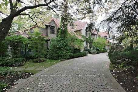 A circular stone driveway brings you to this classic reminiscent of a magical private English country estate in Toronto's exclusive Hogg's Hollow neighbourhood and Bridle Path district.