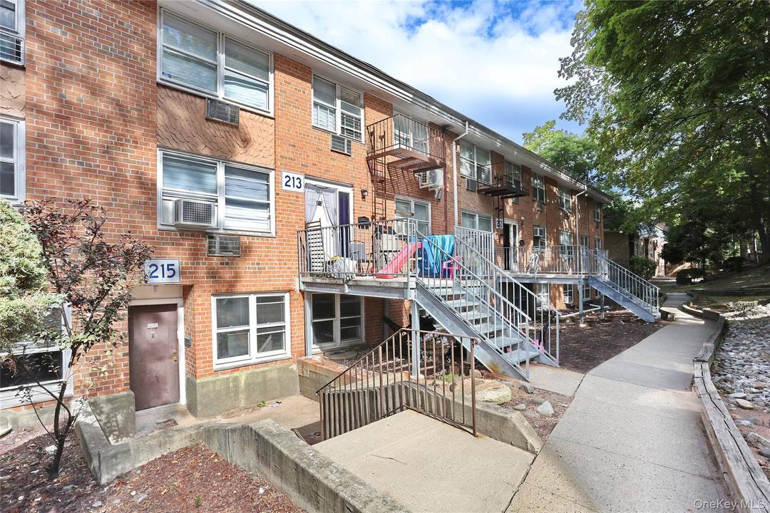 This beautifully renovated three bedroom flat offers modern living with an island kitchen equipped with a second sink and space for seating.