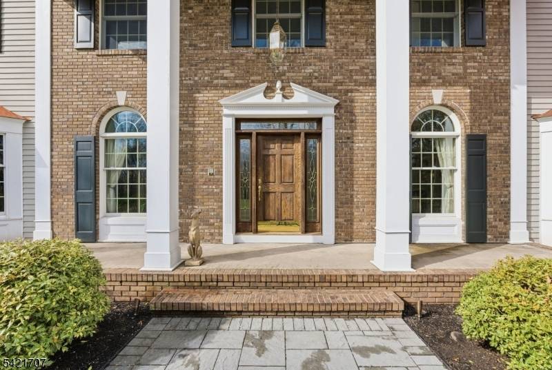 Set on a beautifully manicured property in one of Bridgewater's most sought after enclaves, this distinguished estate embodies timeless sophistication and refined living.