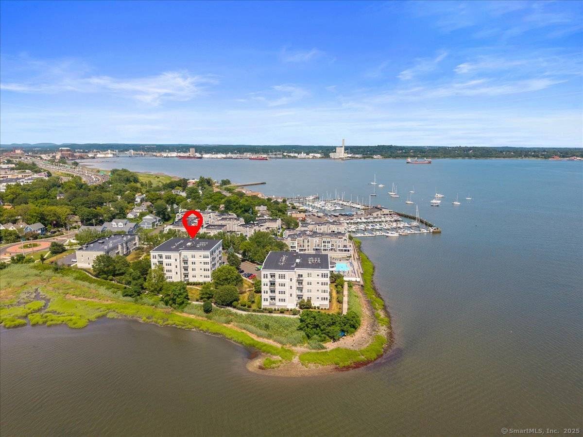 Experience a rare opportunity to own a top floor corner unit with breathtaking views of Long Island Sound in the sought after Breakwater Bay Complex.