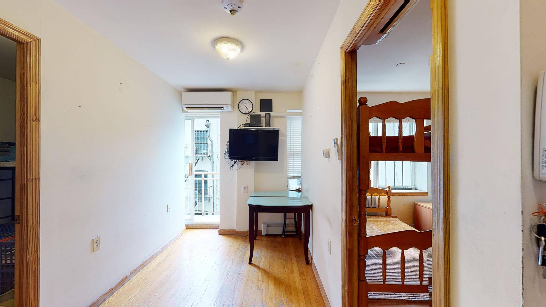 Just when you thought you were priced out of the Manhattan condo market, this sun flooded top floor 1 bedroom with balcony beckons.