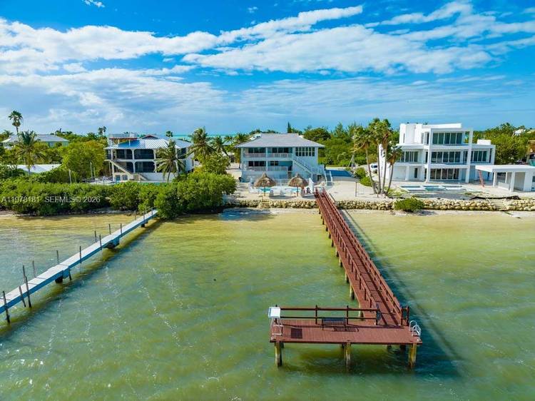 Sprawling Sombrero Beach newly renovated home on an oversized lot with pool, private sandy beach and Open Water Views !