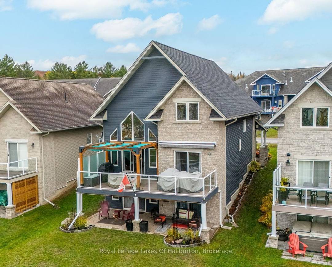 Welcome to this 4 bedroom, 4 bathroom executive home in the prestigious Silver Beach waterfront community on Kashagawigamog Lake, part of the sought after 5 lake chain.