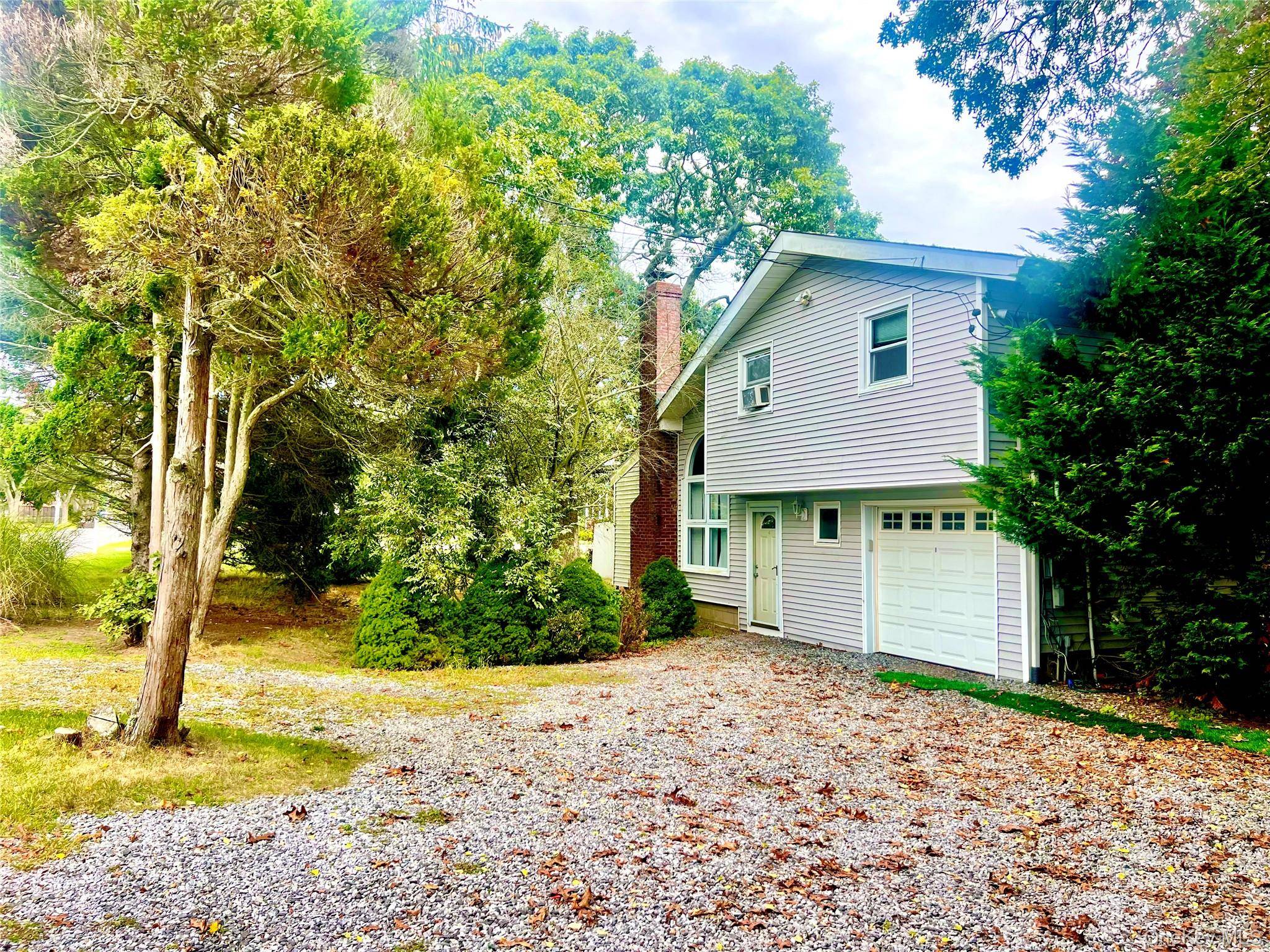 Escape to Your Hamptons Haven Split Level Home with Heated Pool on a Sprawling.