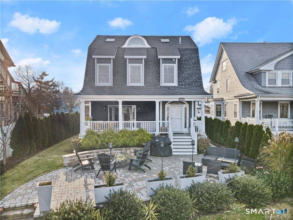 Stunning direct waterfront rental perched on a bluff overlooking Holly Pond on the Darien Stamford line.