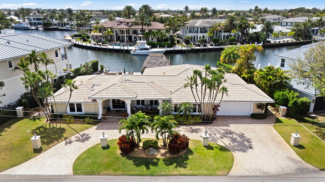 Welcome to your private waterfront retreat on exclusive Lake Placid Island in Lighthouse Point where luxury living meets effortless ocean access.
