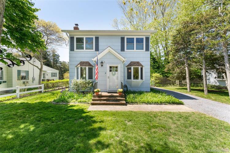 Charming two story summer rental just a block from a private beach, offering the perfect coastal getaway.
