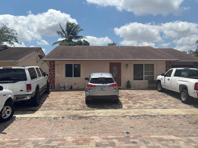This Single family home offers 6 bedrooms and 3 baths in West Lake Worth, impact windows, New HVAC system.